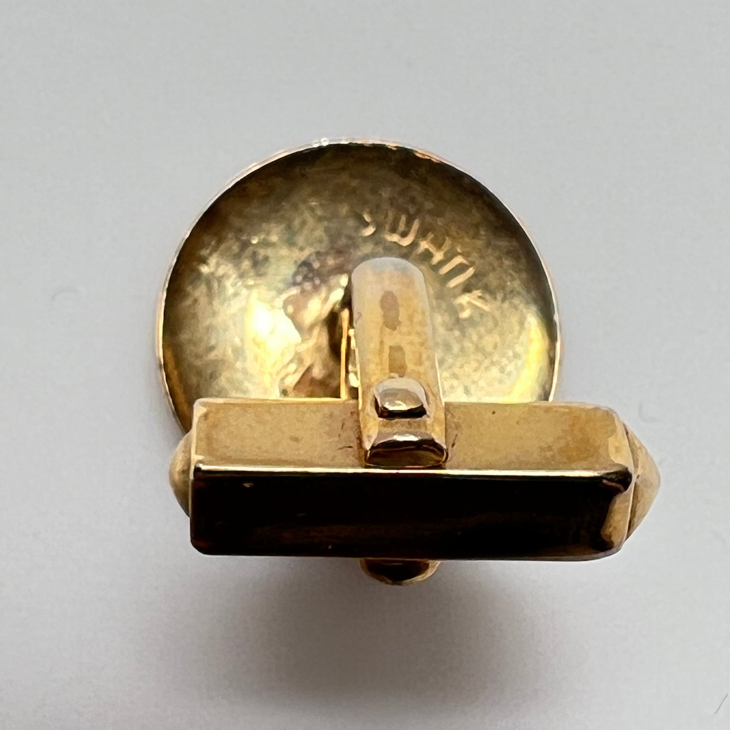Pair of vintage goldtone Swank cufflinks with round engraved face