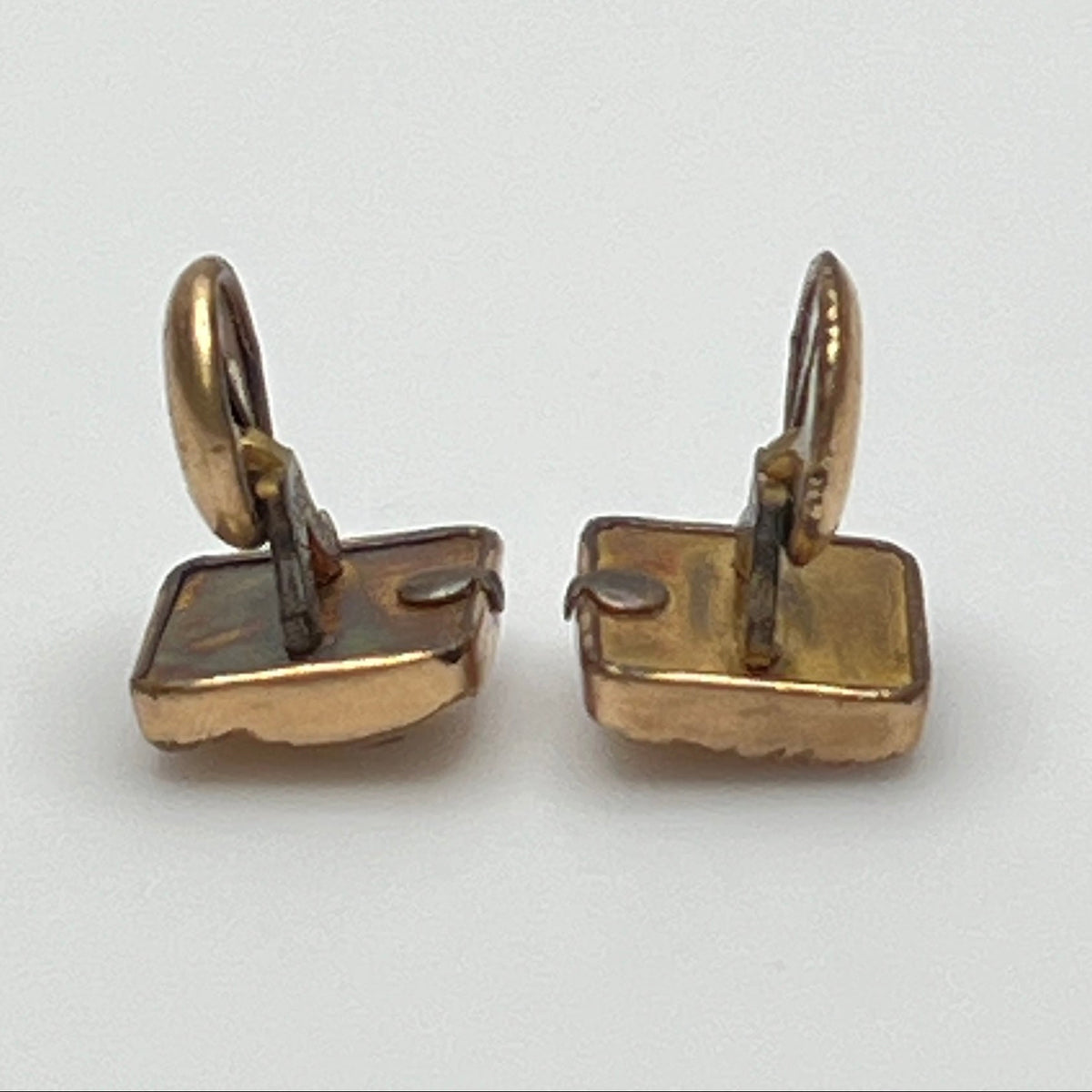 Antique rose gold-tone cufflinks with paste stone and scrollwork, stamped Pat Dec 1883