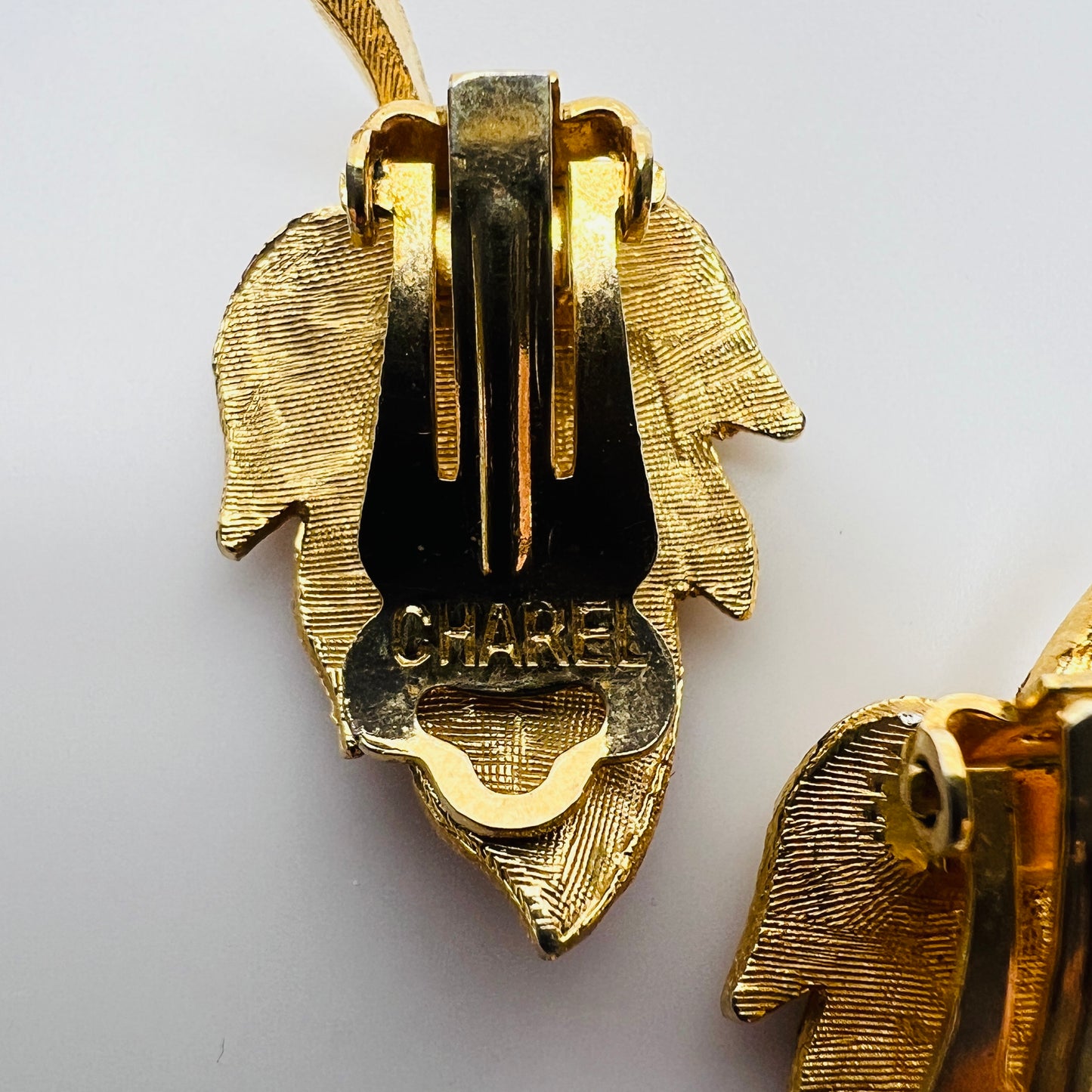 Close-up of Charel signature on earring clip