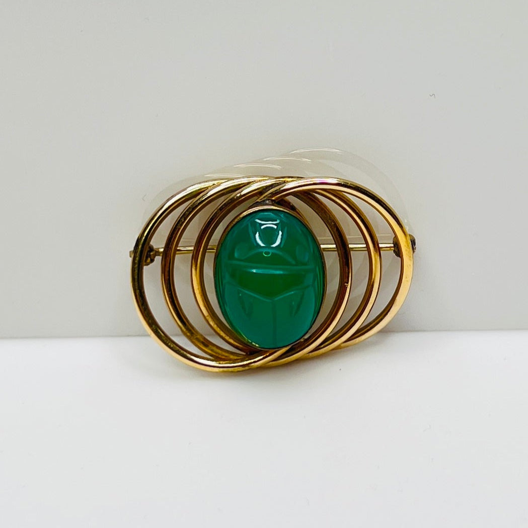 1950s gold-filled scarab brooch with green carved glass