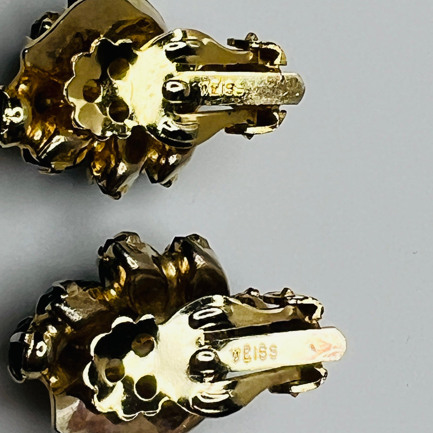 Vintage black rhinestone and gold-tone leaf brooch with matching clip-on earrings