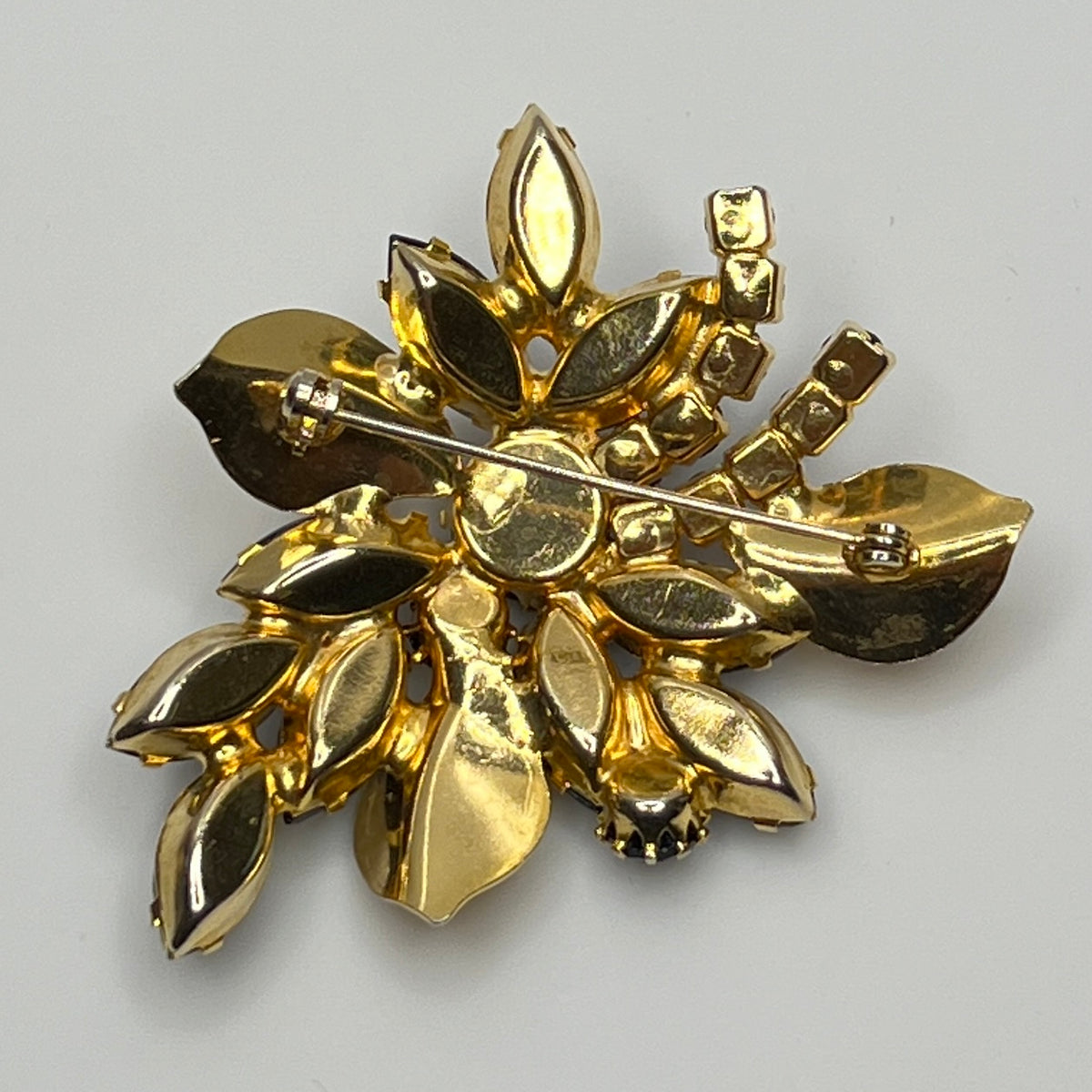 1950s vintage jewelry set with prong-set black stones and sculpted floral design