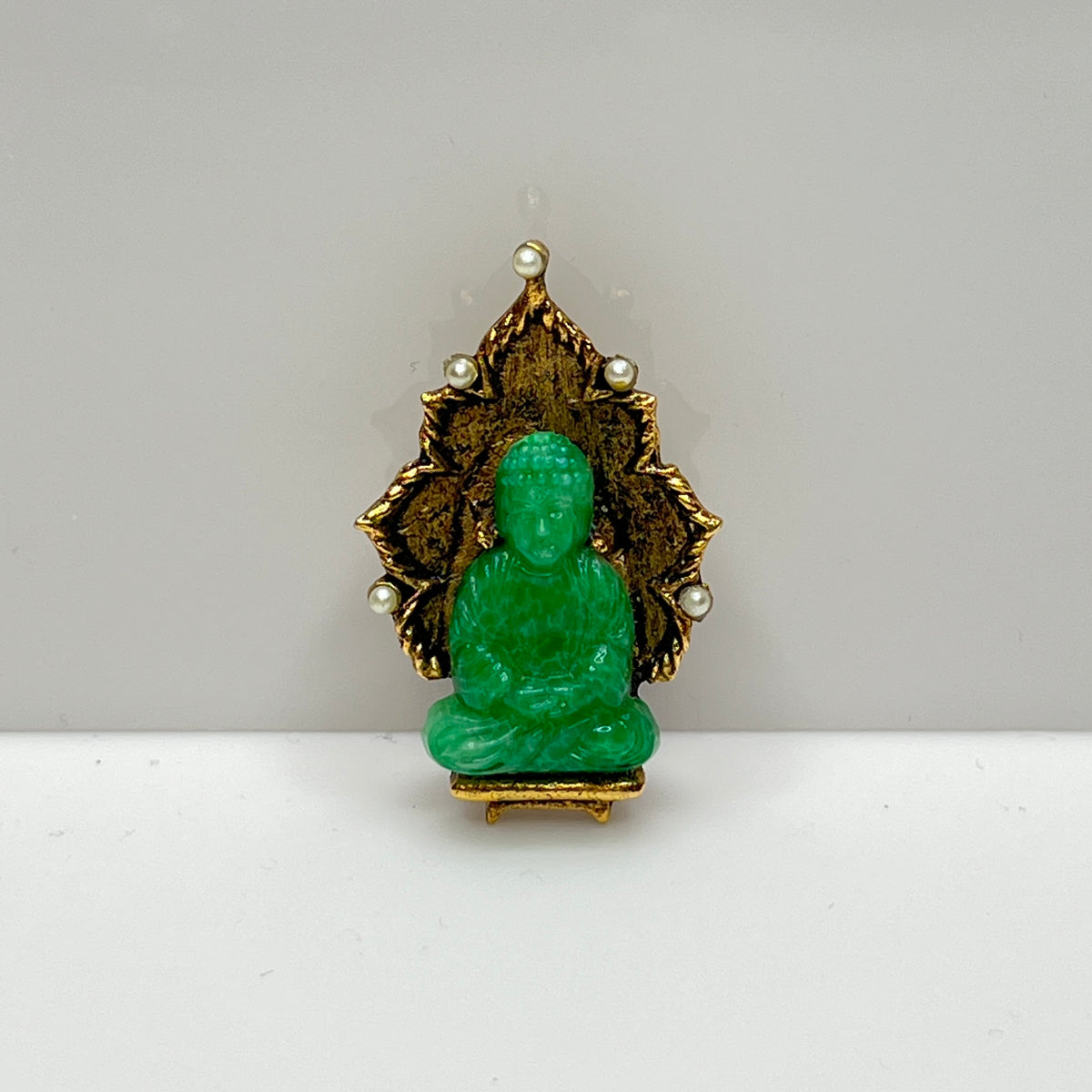 Vintage Ambassador Buddha brooch with jade glass figure and faux pearls