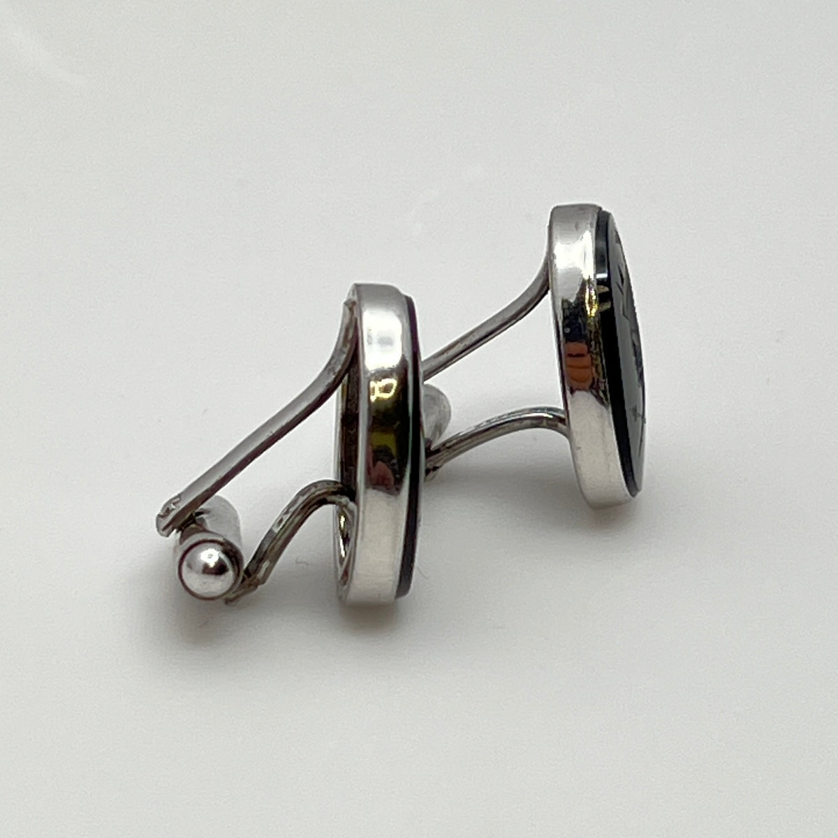Close-up of Anson cufflink with sterling silver setting