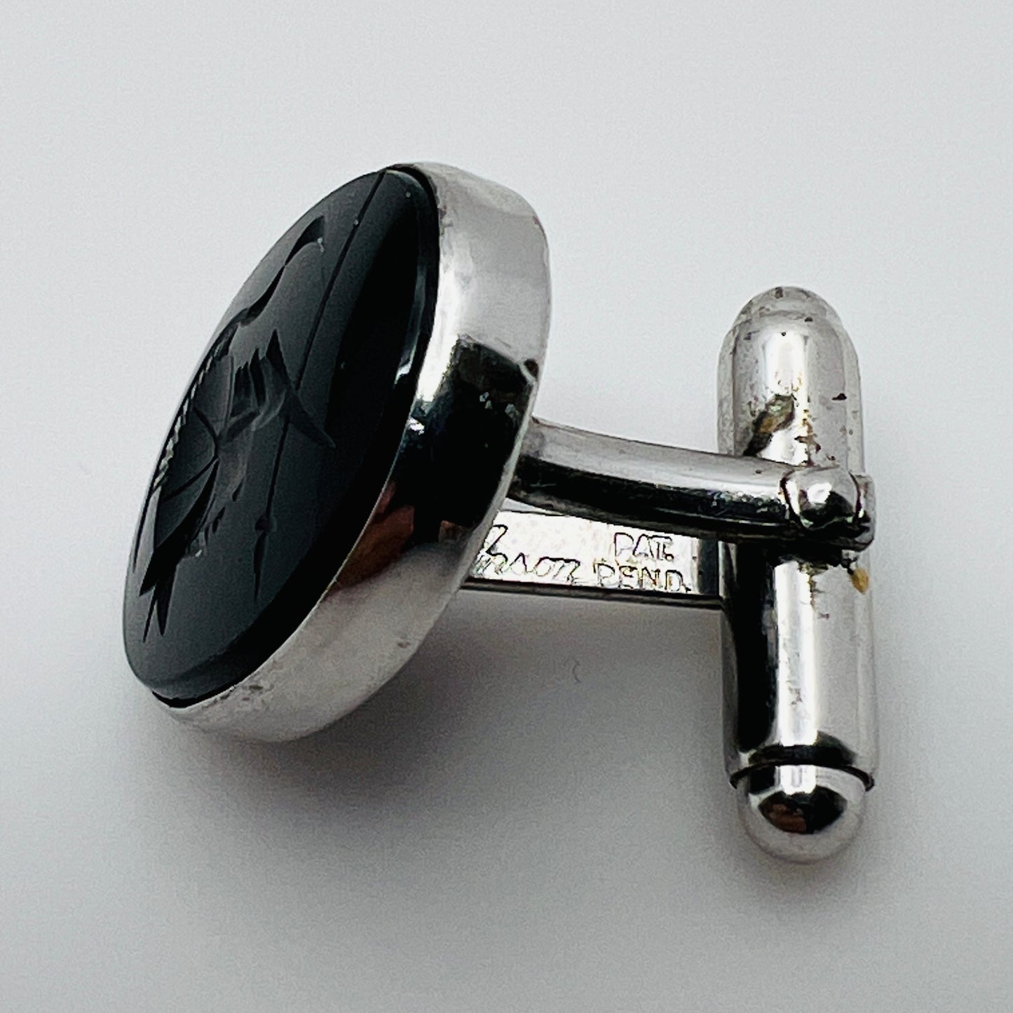 Reverse view of cufflinks marked Anson Pat. Pend Sterling