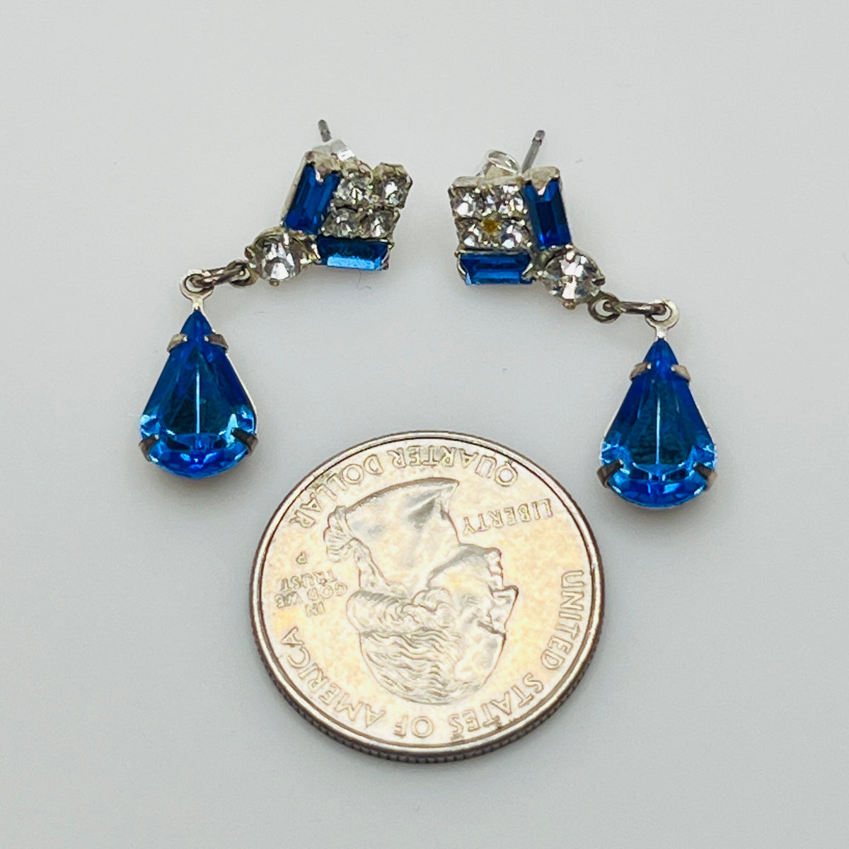 1930s-inspired rhinestone earrings with sapphire teardrops