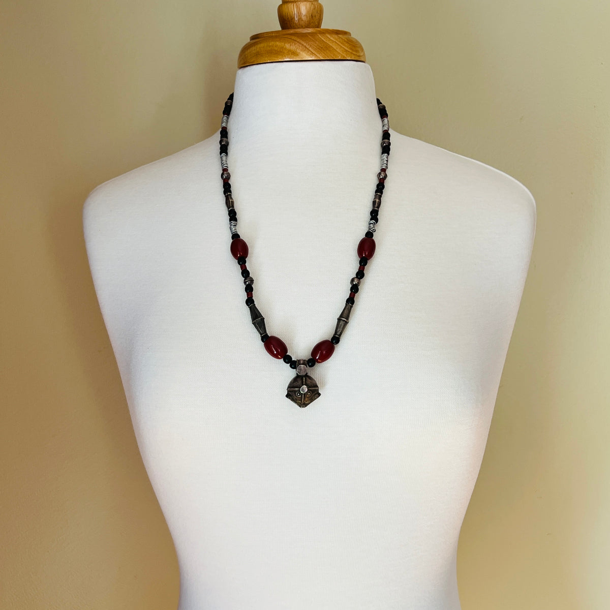 Vintage ethnic-inspired red ceramic and black glass bead necklace with matching earrings and silver-tone pendant