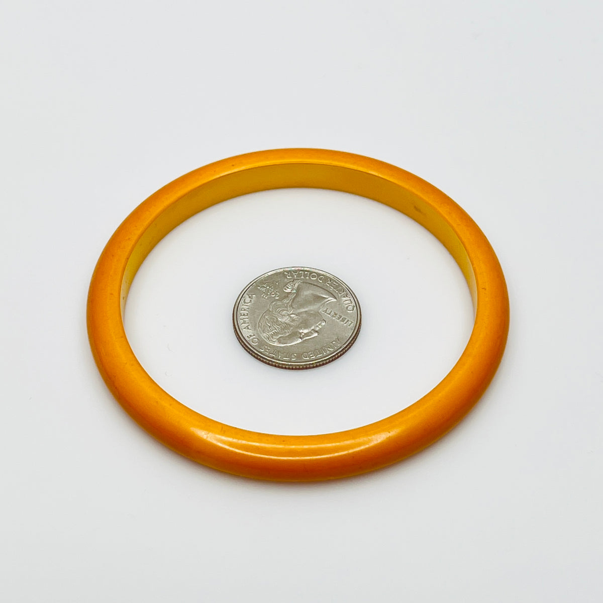 Smooth round Bakelite bangle in warm butterscotch color, size 8 fit