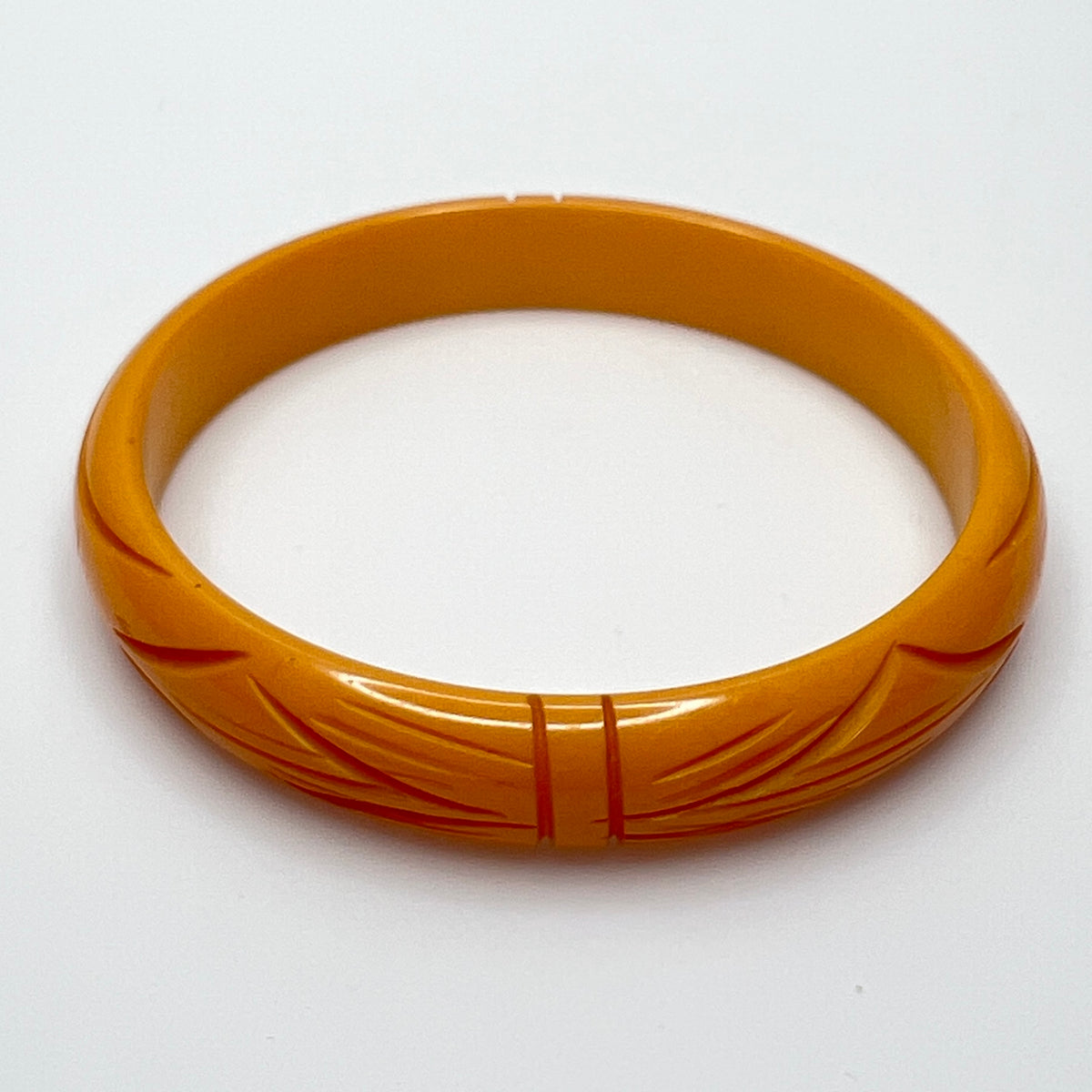 Carved Art Deco Bakelite bangle, ½ inch wide, size 7.75