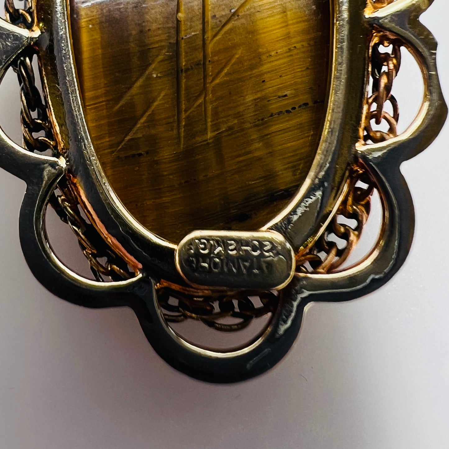 Reverse showing Catamore 12K gold-filled mark and pin mechanism