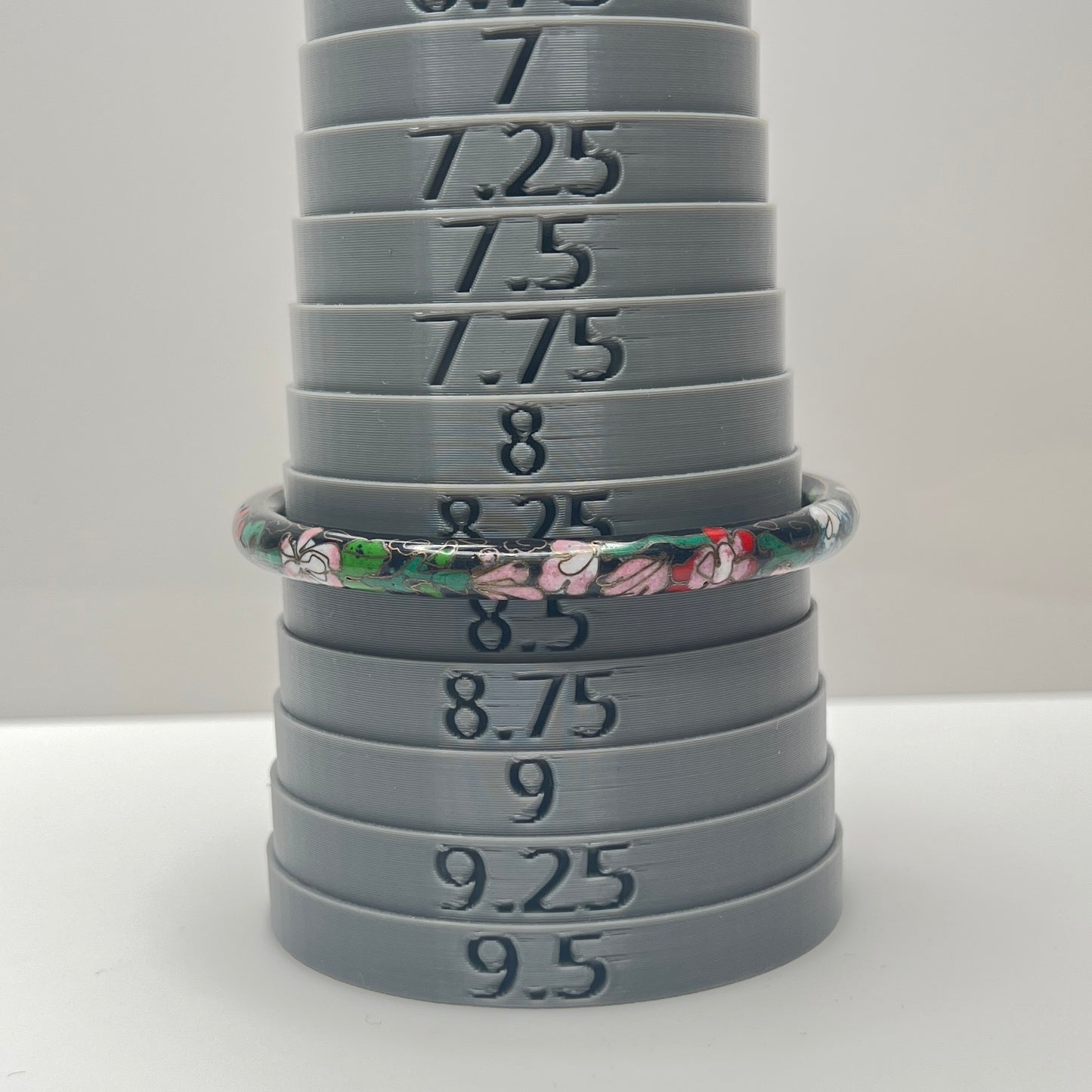 Close-up of cloisonné detail with gold wire outlines