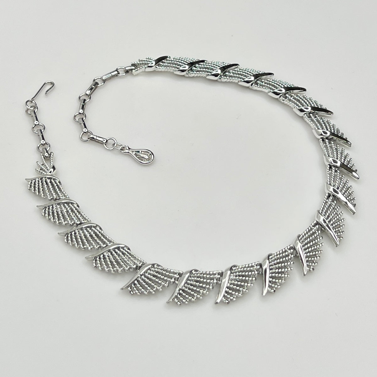 Side view of textured and polished mid-century fan design