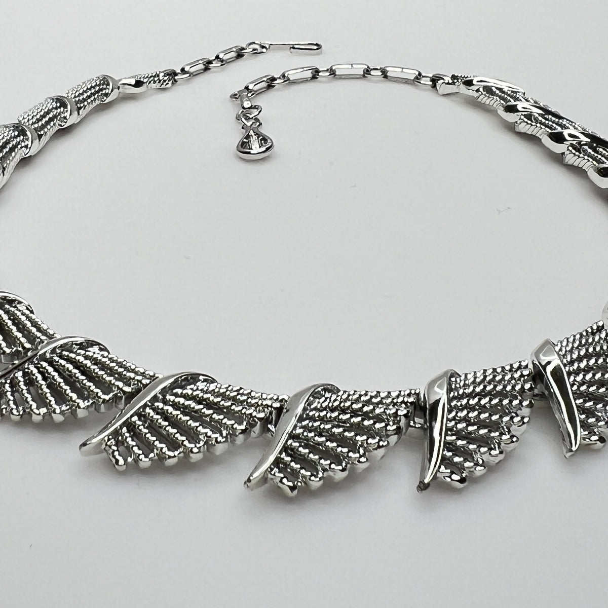 Side view of textured and polished mid-century fan design