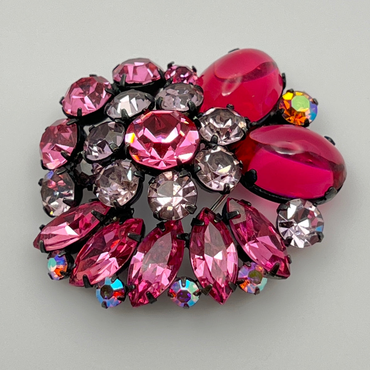 1960s pink glass rhinestone brooch with matching aurora borealis earrings