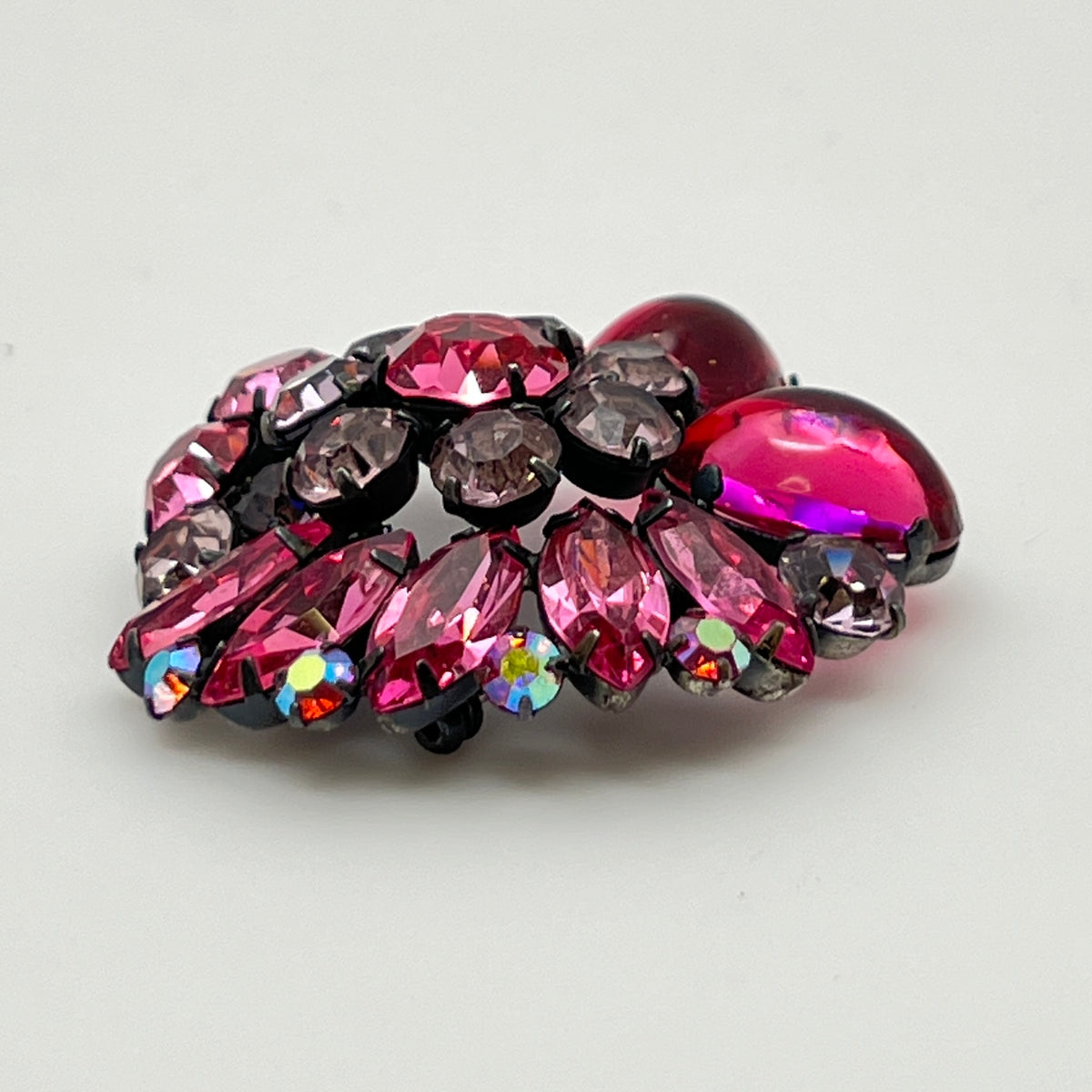 1960s pink glass rhinestone brooch with matching aurora borealis earrings