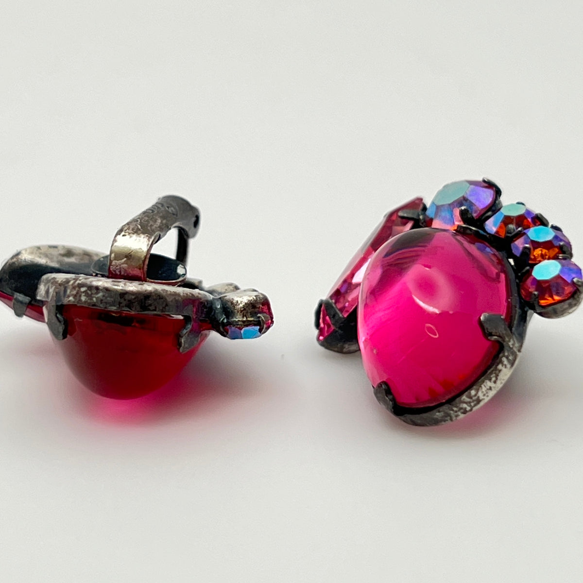 Close-up of signed Coro earrings with prong-set rhinestones