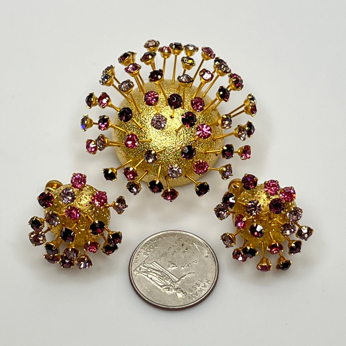 Corocraft goldtone Sputnik brooch with pink and purple rhinestones, mid-century style