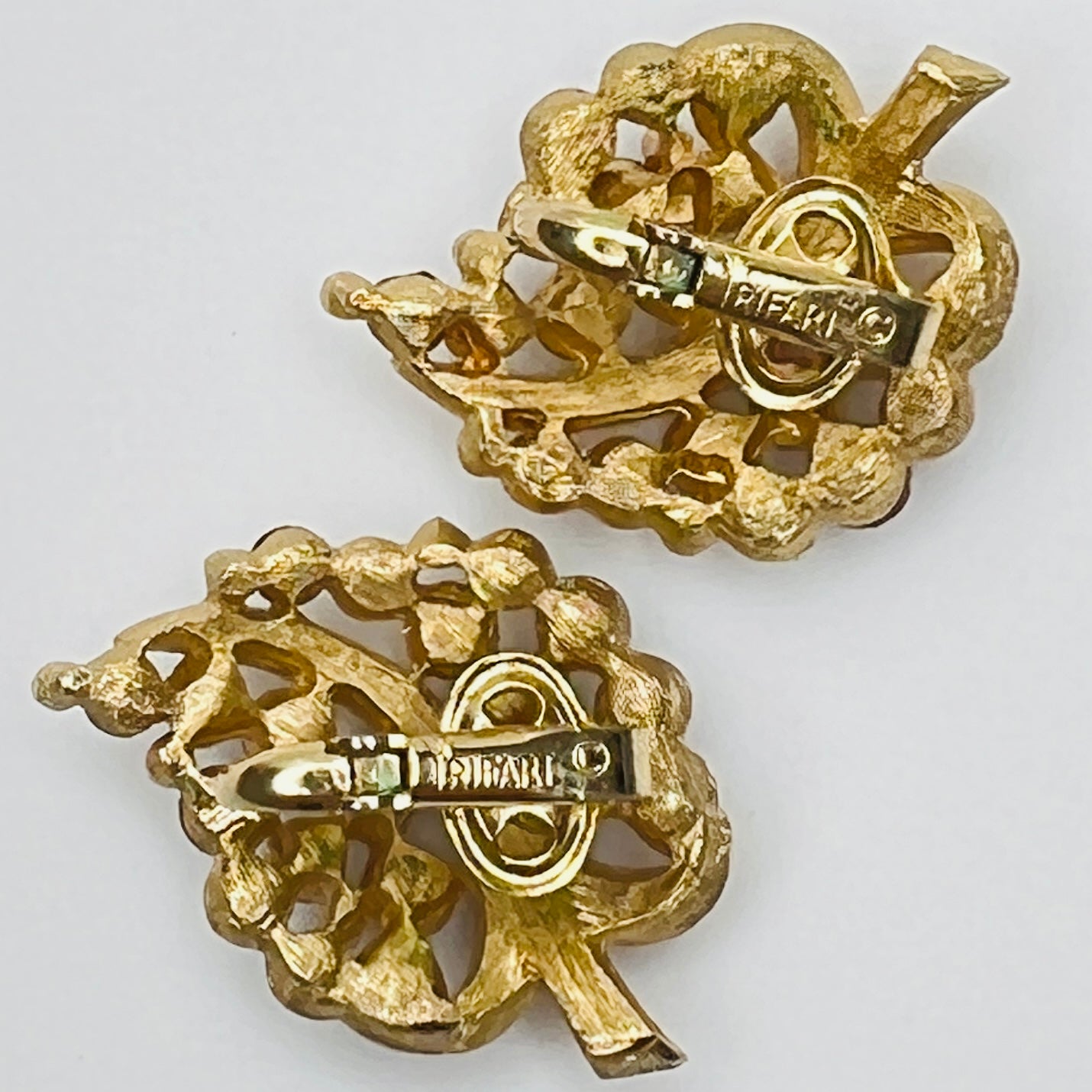 Pair of Crown Trifari rhinestone clip-on earrings with gold-tone finish