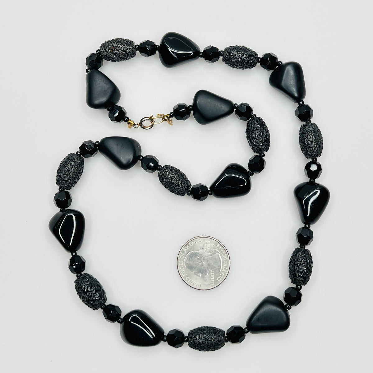 1980s black bead necklace coiled flat, 24 inches long