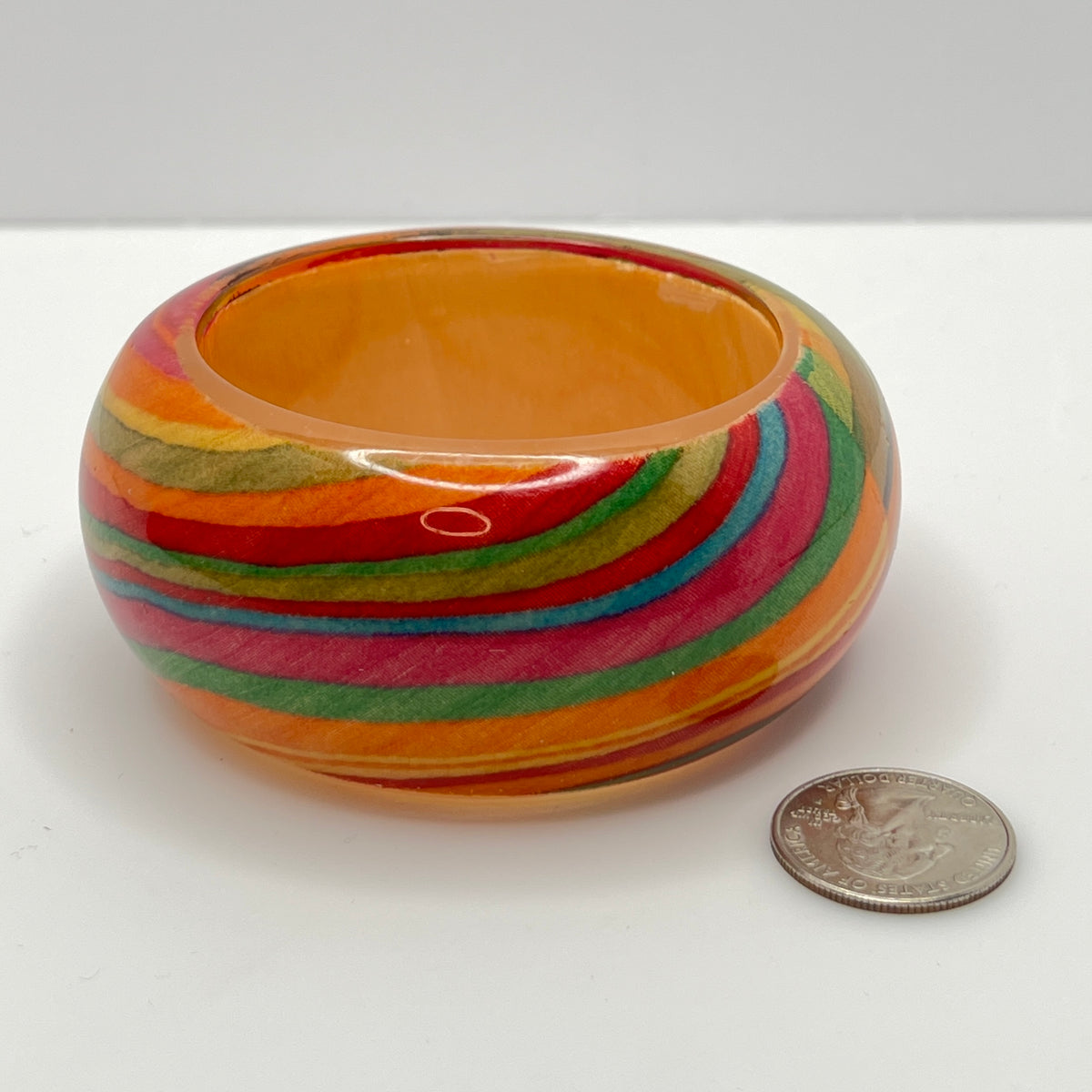 Wide retro lucite bangle bracelet with rainbow earth-tone stripes