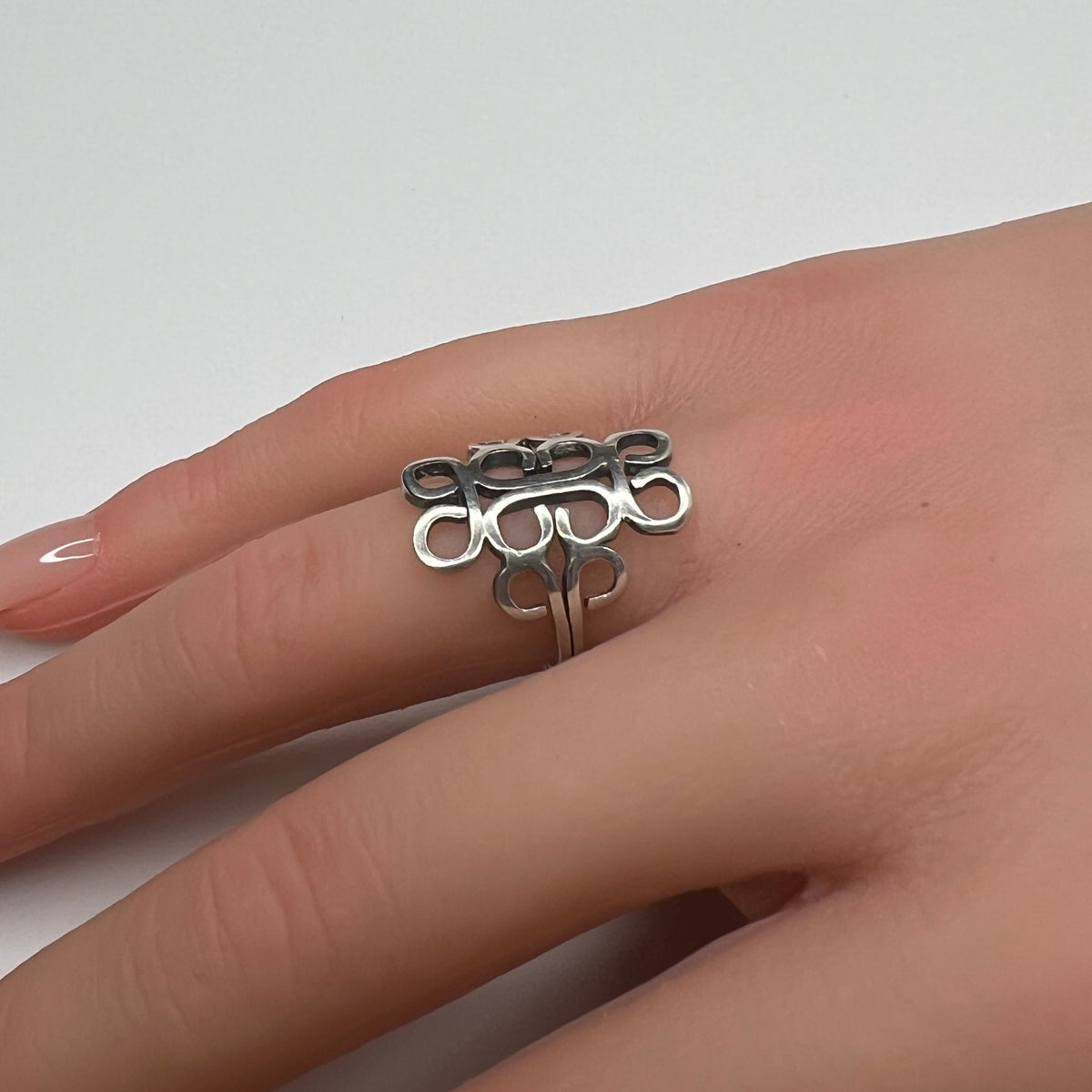Vintage sterling silver Mexican swirl ring with openwork Aztec design