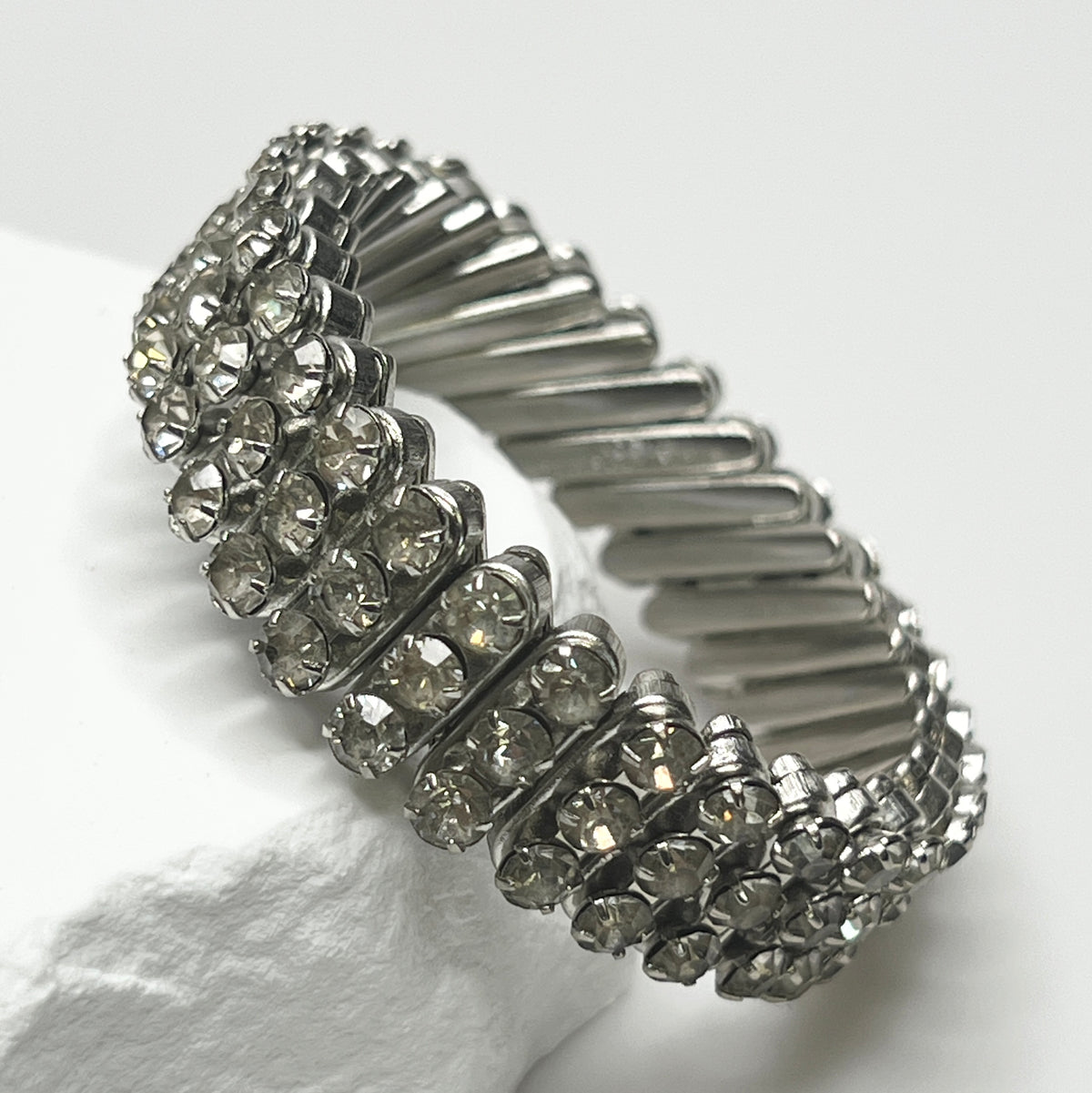 Close-up of vintage silver-tone accordion rhinestone bracelet