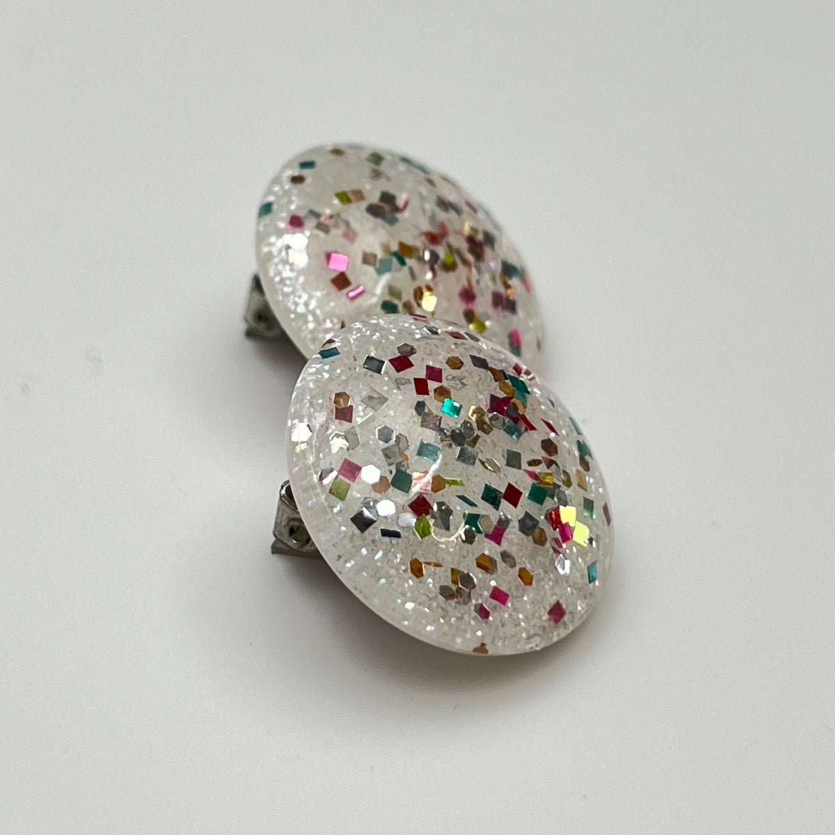 1950s round button earrings with multicolor glitter inside clear lucite