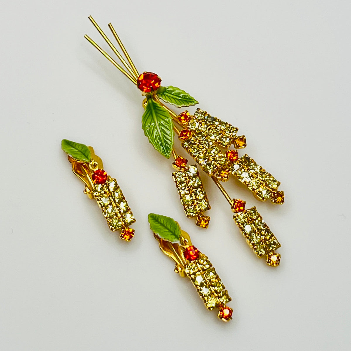1950s rhinestone brooch and earring set with amber stones, enamel leaves, and cat tail motif.