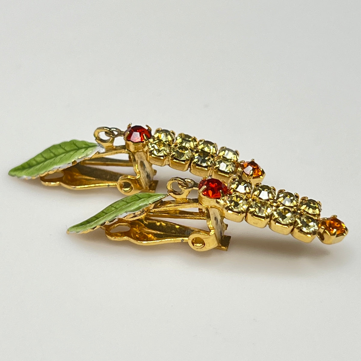 1950s rhinestone brooch and earring set with amber stones, enamel leaves, and cat tail motif.