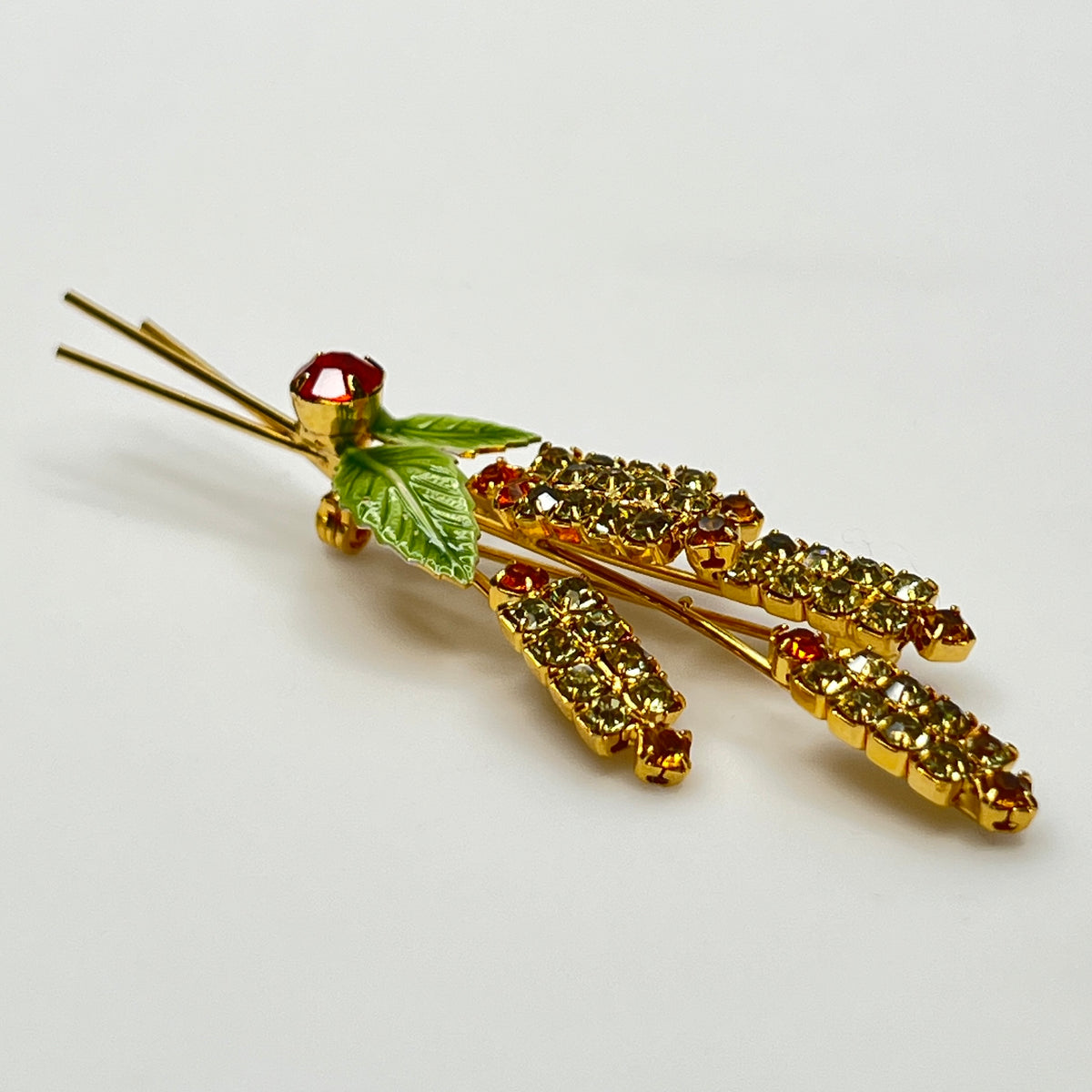 1950s rhinestone brooch and earring set with amber stones, enamel leaves, and cat tail motif.