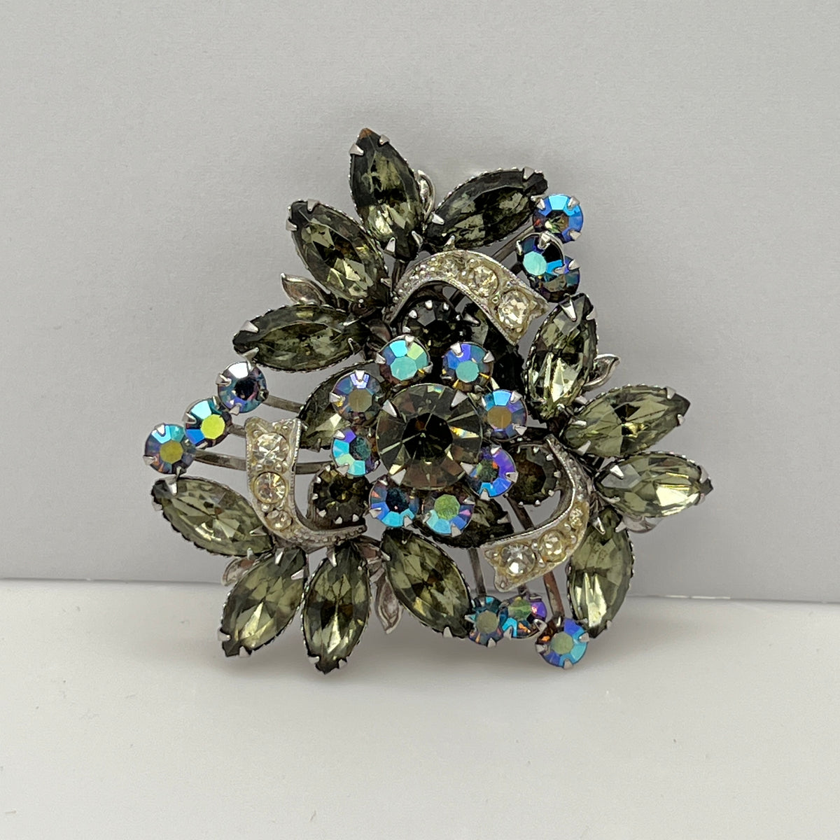 Close-up of aurora borealis floral cluster in vintage statement brooch