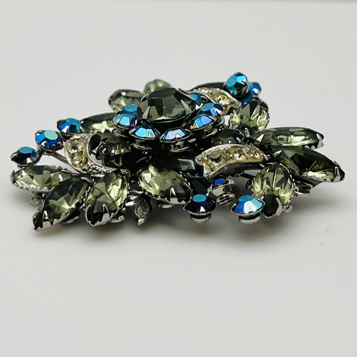 Vintage brooch with olive green navette rhinestones and aurora borealis crystals