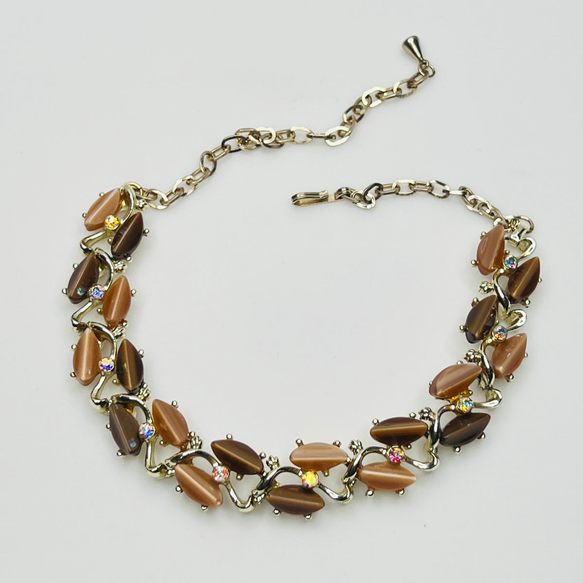 Mid-century necklace laid flat with hook and extender chain