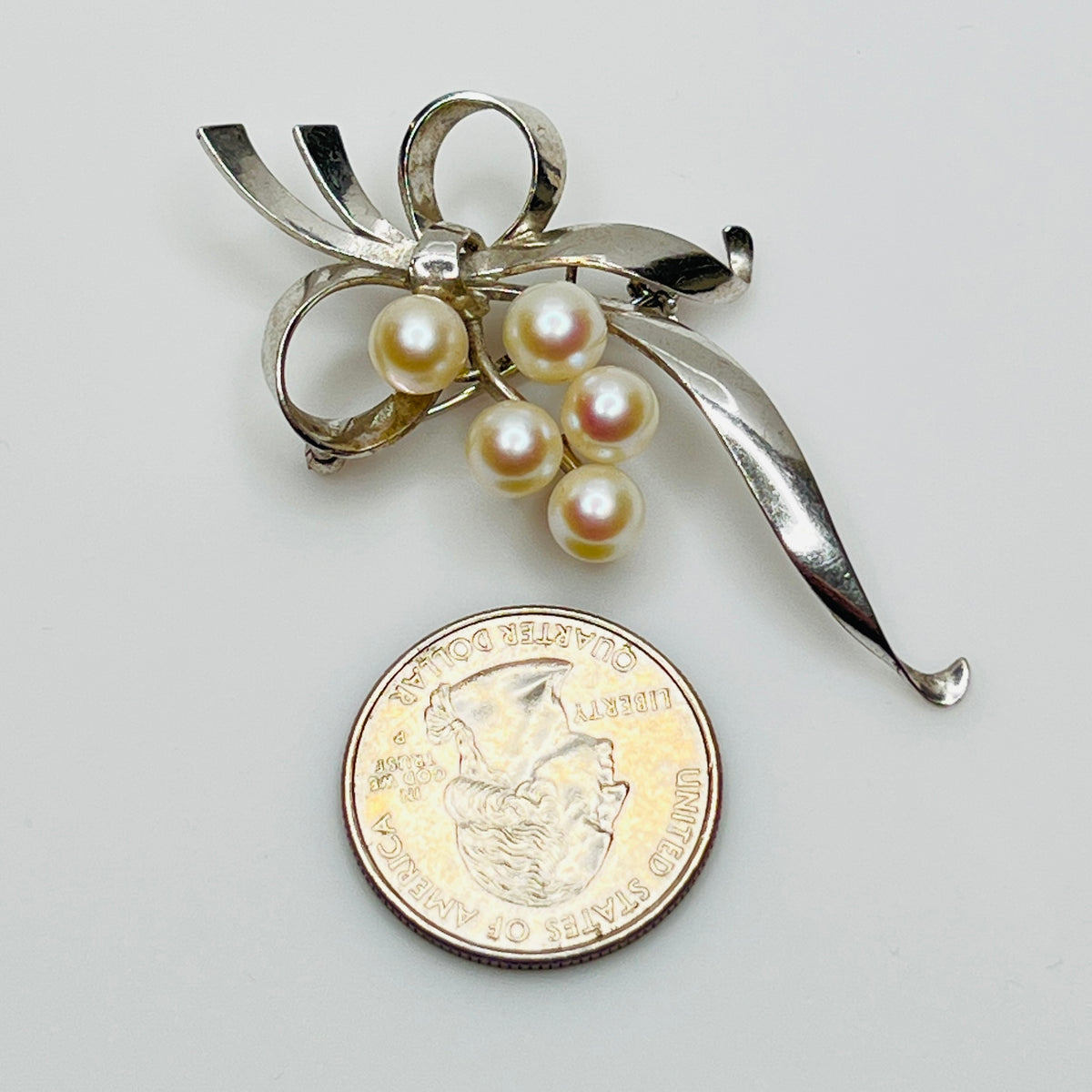 Mikimoto sterling silver brooch with Akoya pearls in lily of the valley design