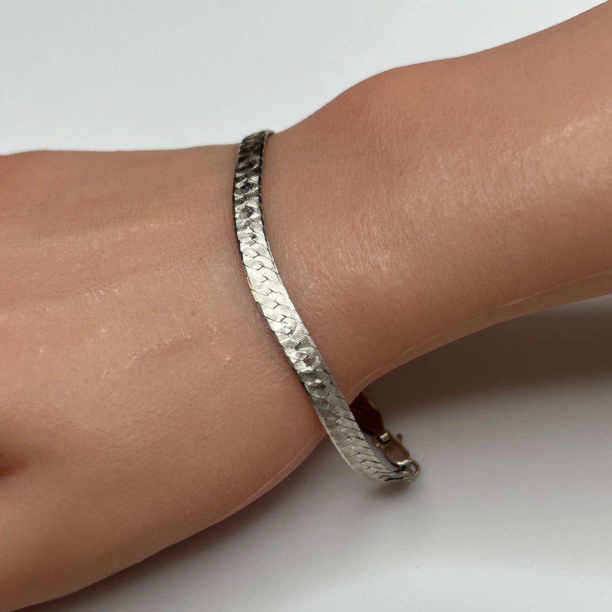 Vintage Milor sterling silver textured snake chain bracelet worn on wrist
