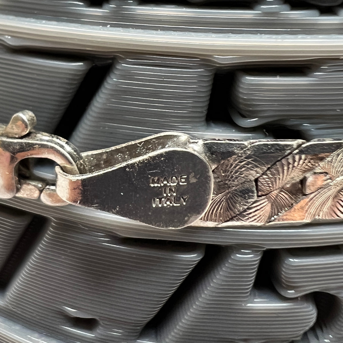Close-up of clasp stamped “Made in Italy"on sterling silver Italian bracelet