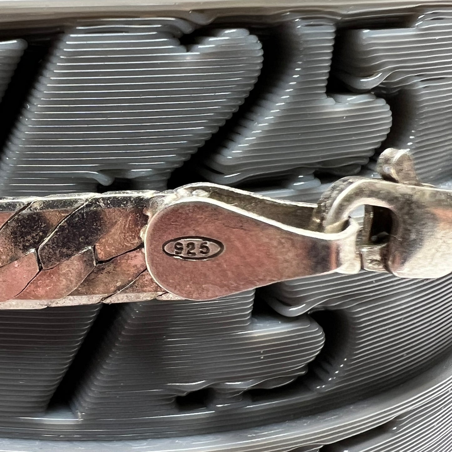 Close-up of clasp stamped “925” on sterling silver Italian bracelet