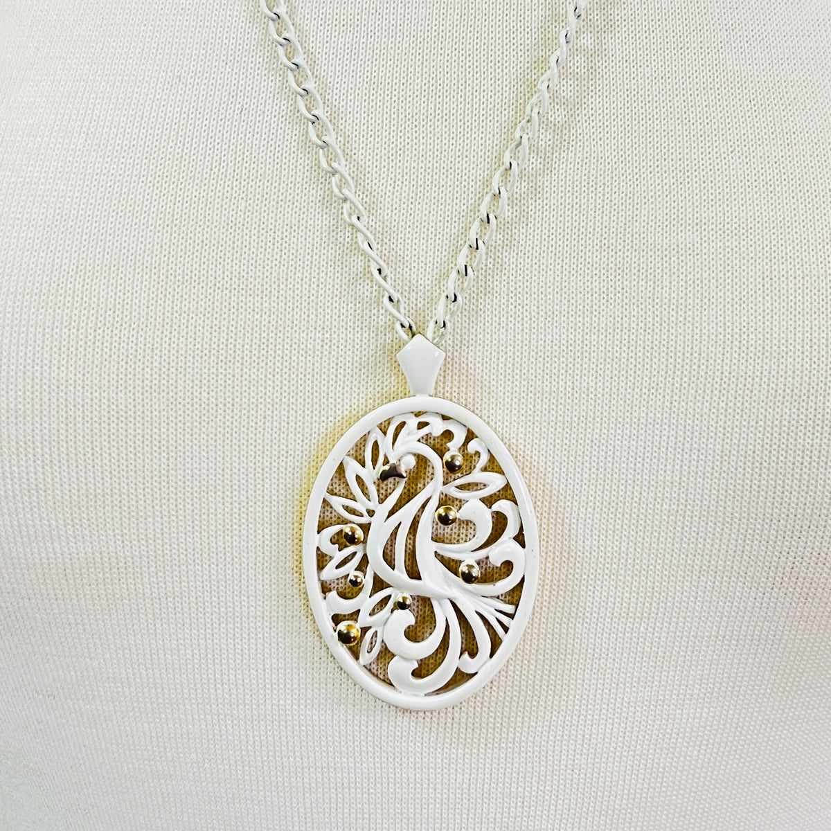 White enamel Monet jewelry set with bird of paradise motif
