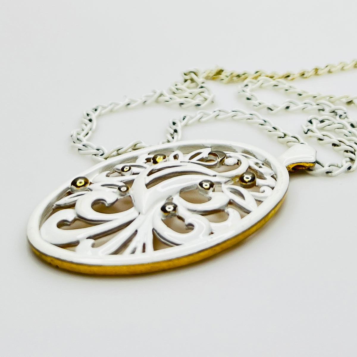 White enamel Monet jewelry set with bird of paradise motif