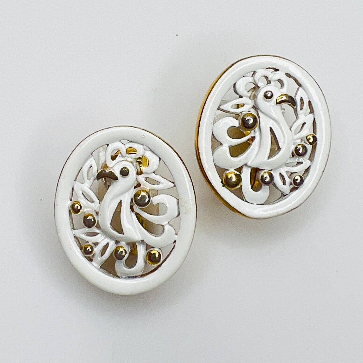White enamel Monet jewelry set with bird of paradise motif