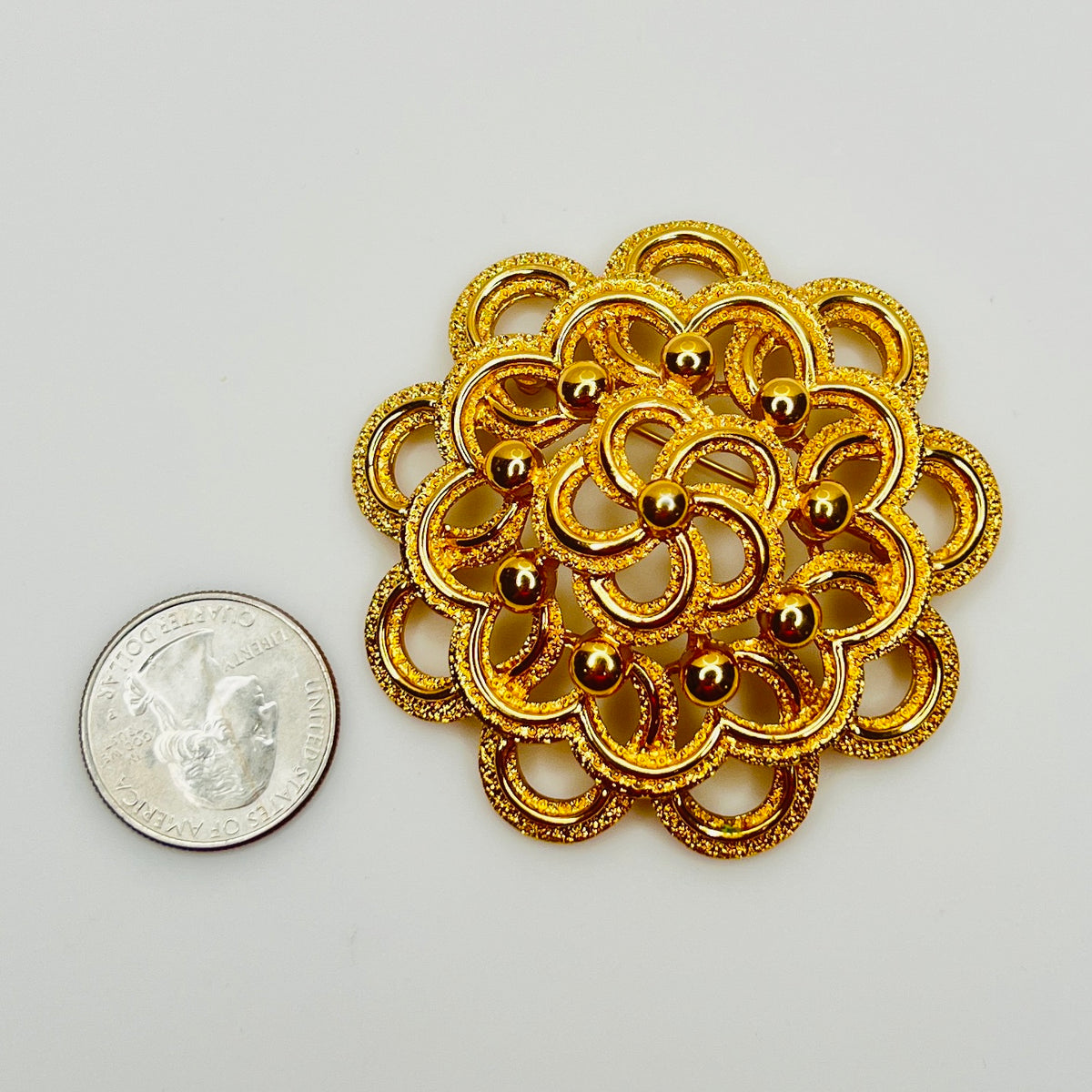 Large Monet gold tone mid century flower brooch