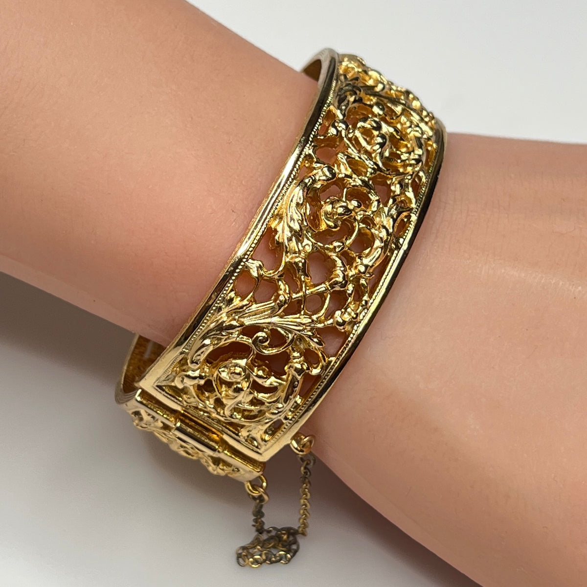 Close-up of ornate floral openwork design on vintage Napier bracelet