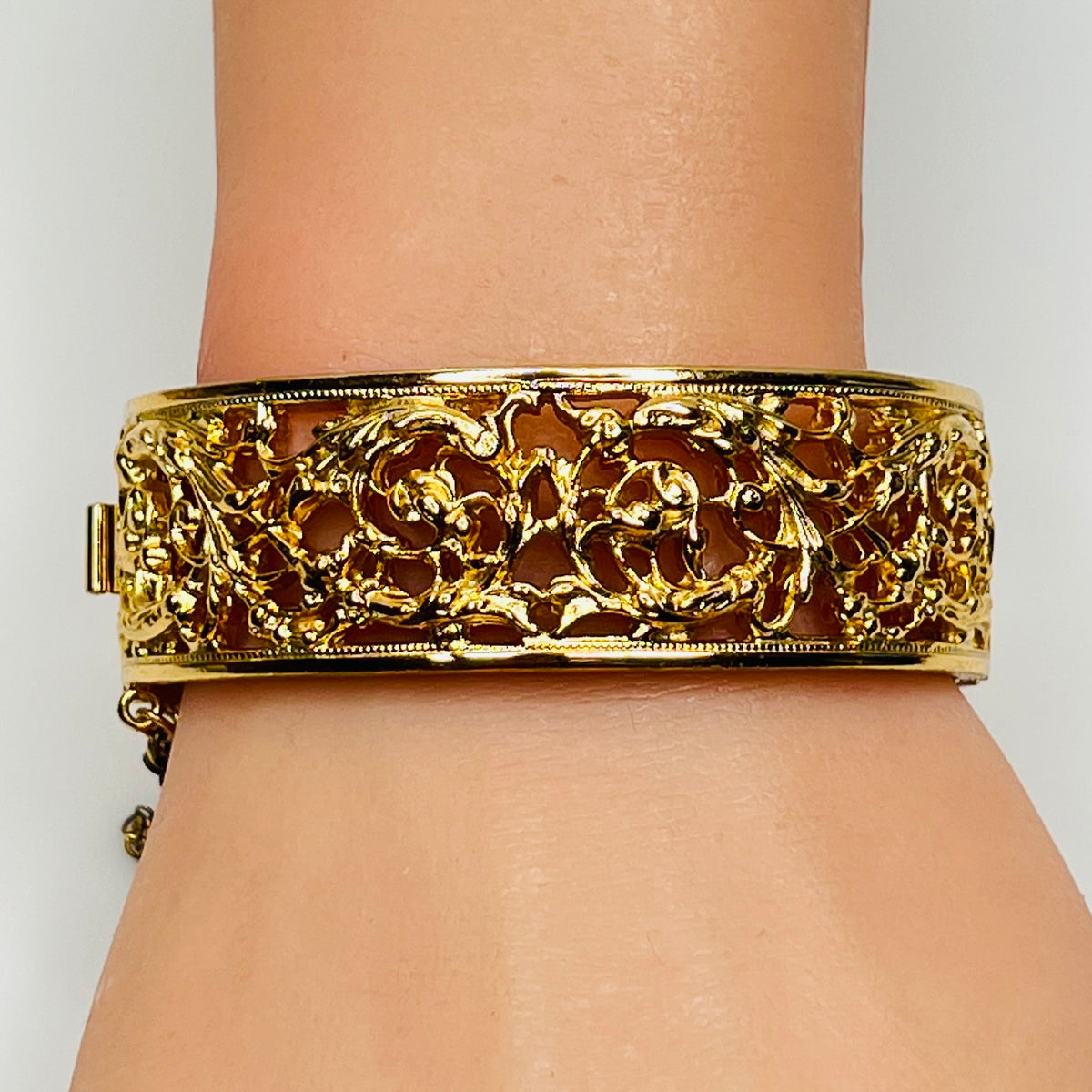 Close-up of ornate floral openwork design on vintage Napier bracelet
