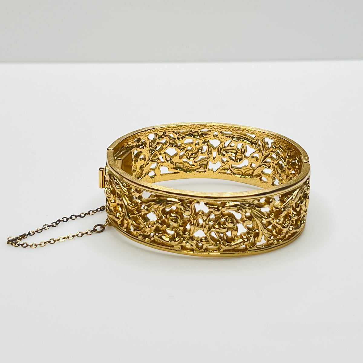 Vintage Napier gold filigree hinged bangle bracelet with safety chain