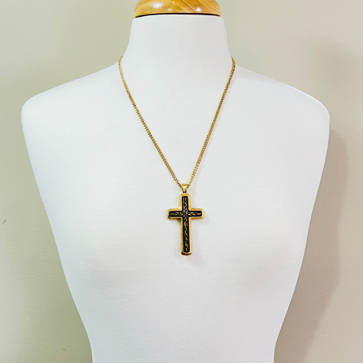 Vintage Sarah Coventry cross necklace shown on mannequin bust