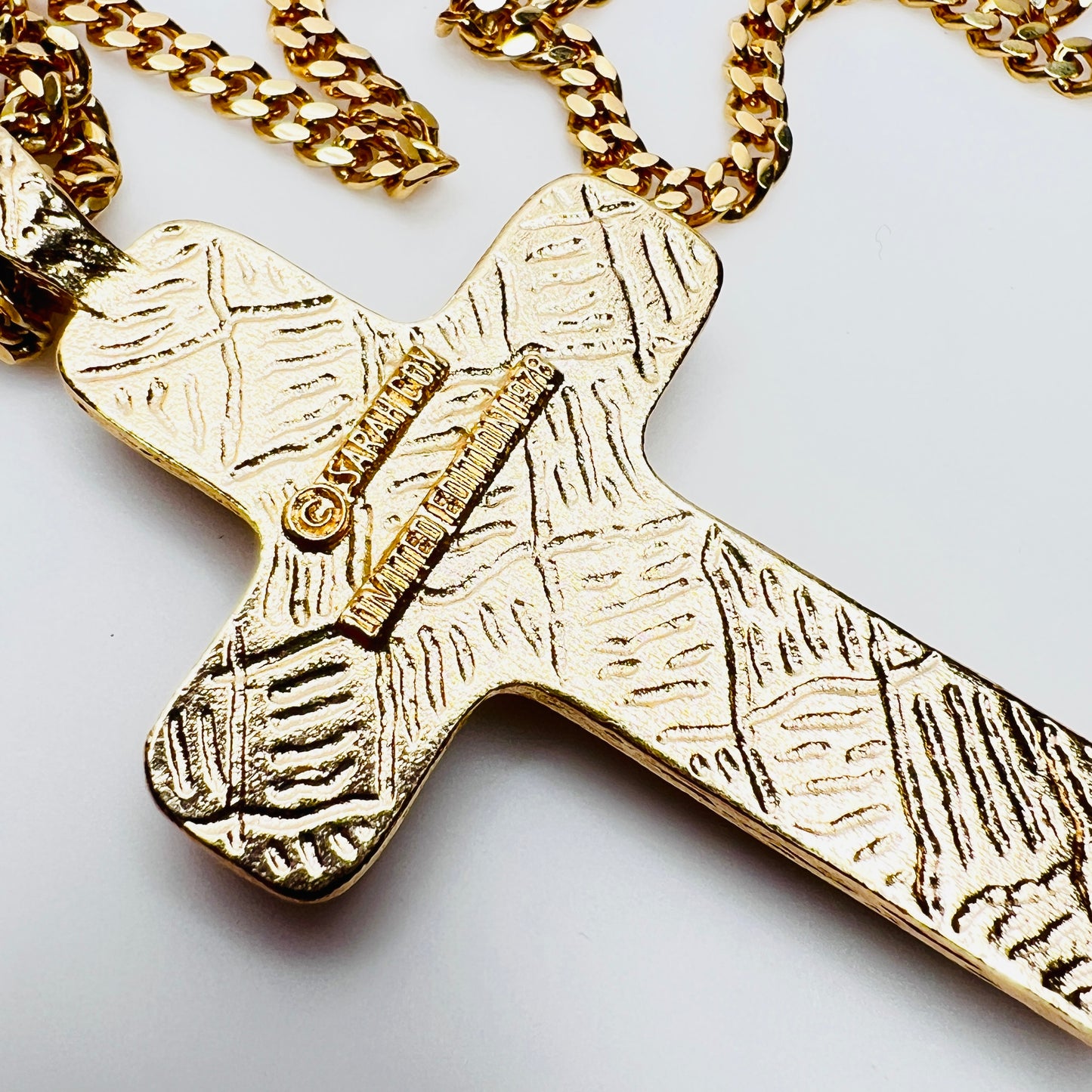 Vintage Sarah Coventry mythology cross necklace from 1978 limited edition collection. Large gold tone cross pendant with long chain.