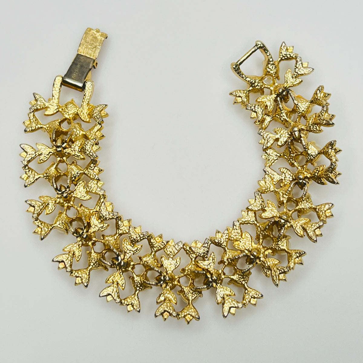 Vintage Sarah Coventry gold-tone bracelet with faux pearls and rhinestones.