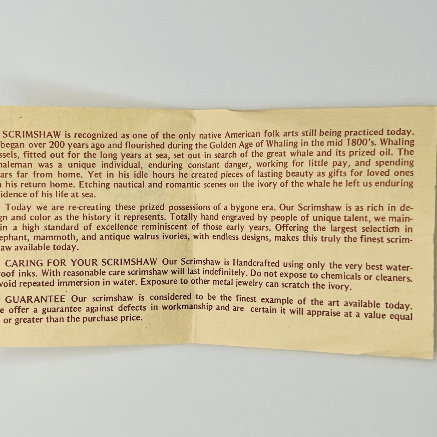 Beige card with text about New England scrimshaw