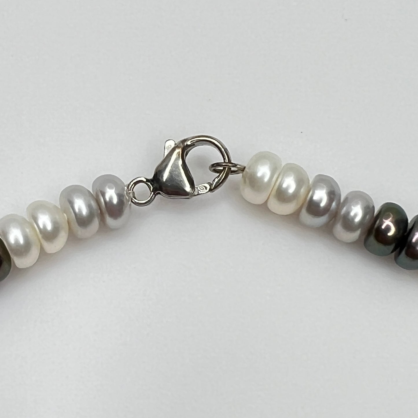Sterling silver lobster clasp stamped 925 on cultured pearl necklace