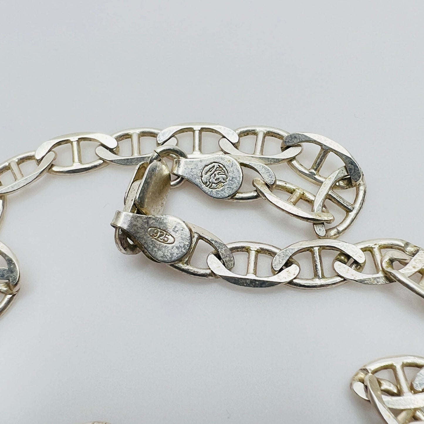 Close-up of sterling silver lobster clasp marked 925 Italy